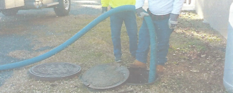 John's Septic Service truck on job site in Harford County Maryland